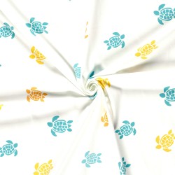 Tissu Jersey coton Tortues Jaune Turquoise et Orange Fond Blanc Cassé | Tissus Loup